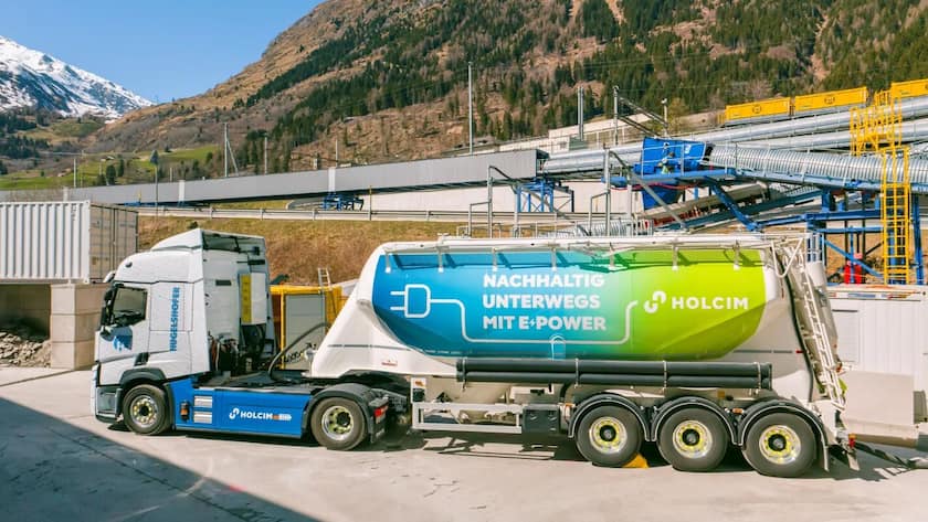 Infrastrukturmodernisierung und Wachstumschancen: Zwei neue Kaufempfehlungen für Holcim E-LKW-Lieferung für die zweite Gotthardröhre in Airolo.